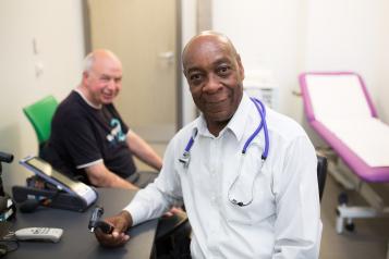 Male doctor speaking to a patient 