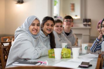 Group of young volunteers smiling at the camera