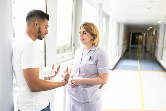 Man talking to a nurse